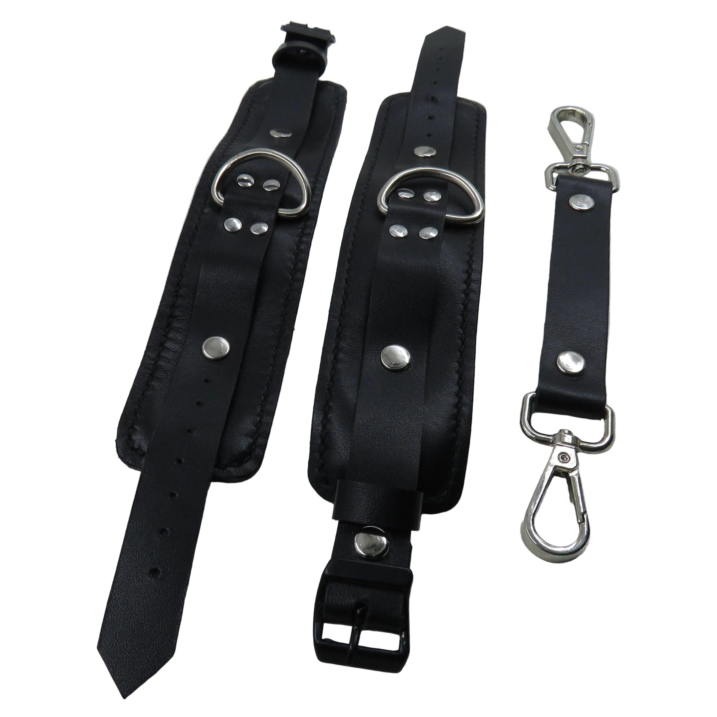 Black leather straps with metal hardware on a white background