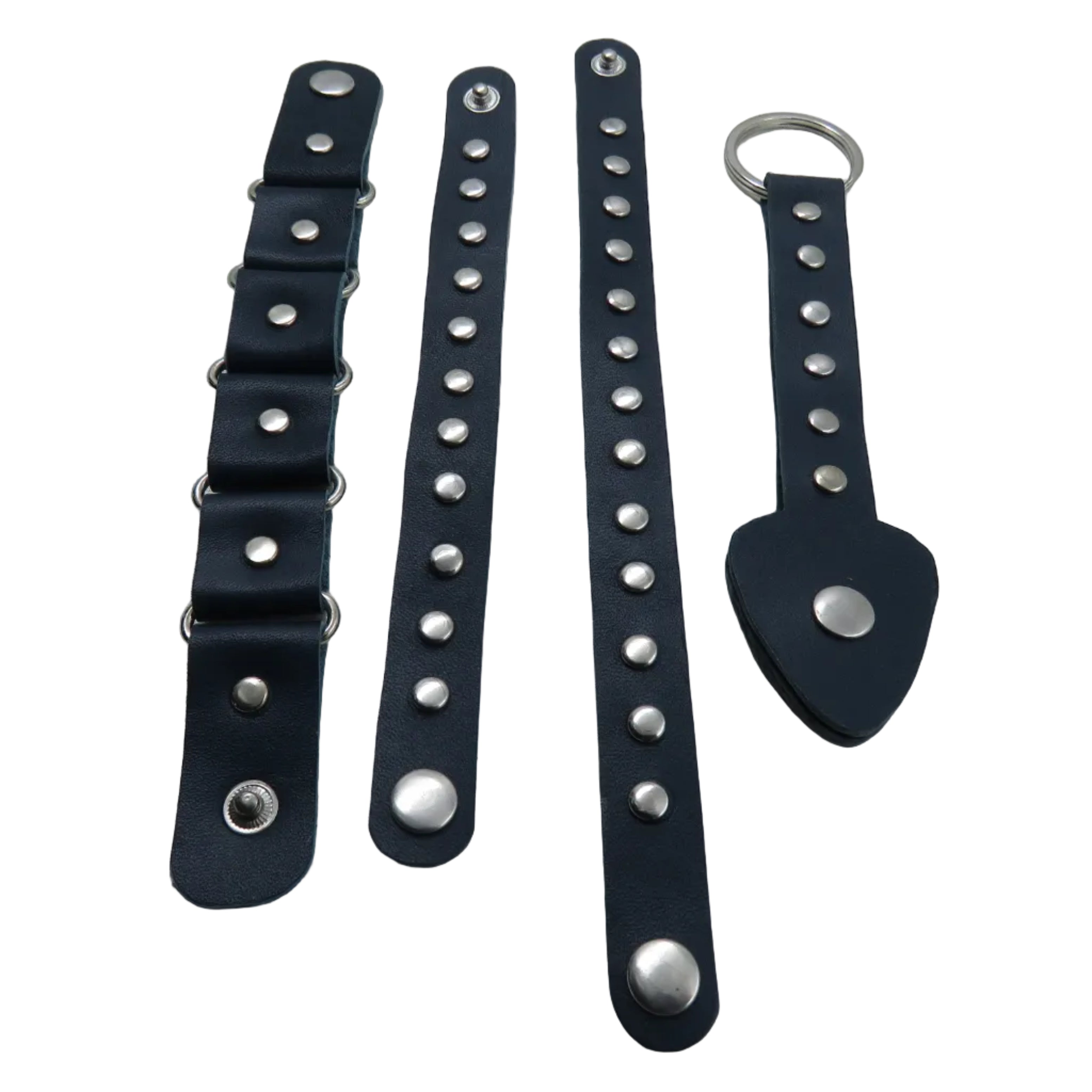 Set of black leather straps with silver studs and rings on a white background