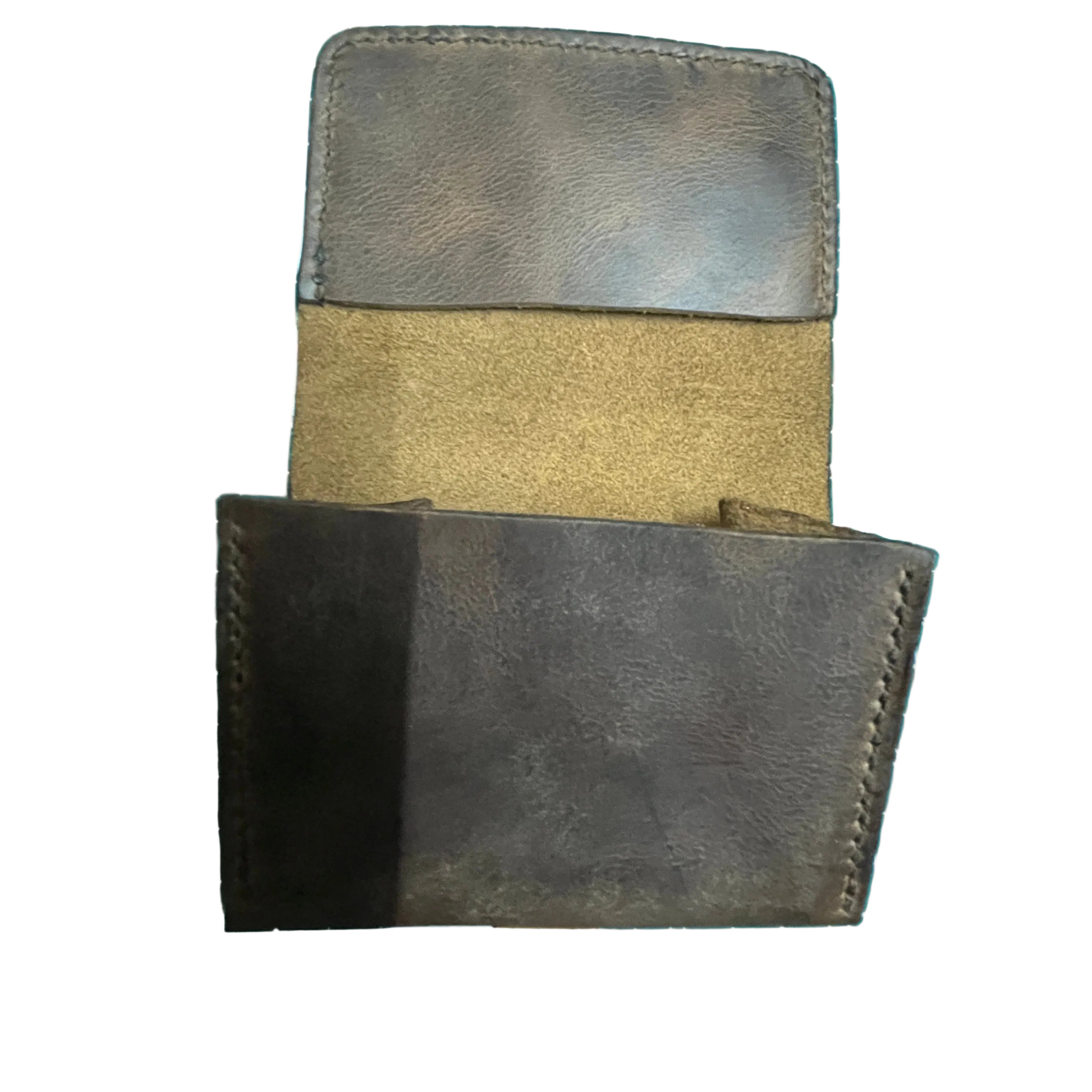 Two leather wallets on a cutting mat with measurements.