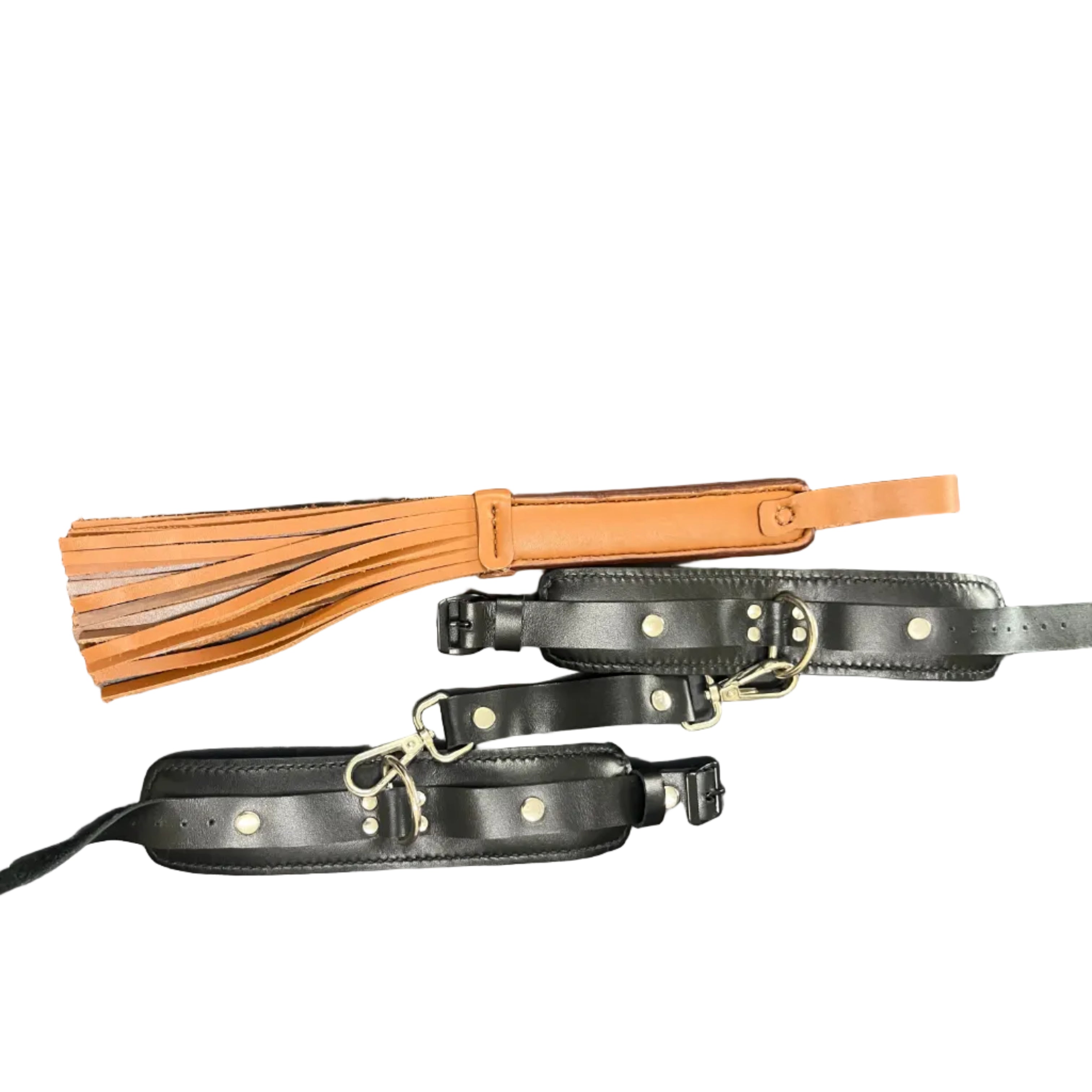 Black leather straps with gold hardware and a brown leather strap with tassels on a black background.