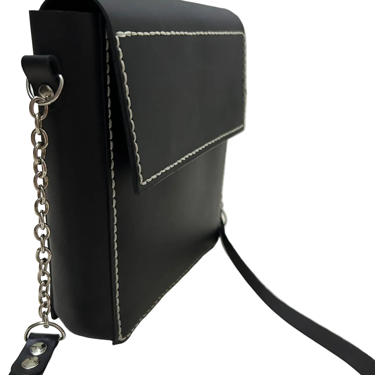 Black leather handbag with chain detail on a light surface