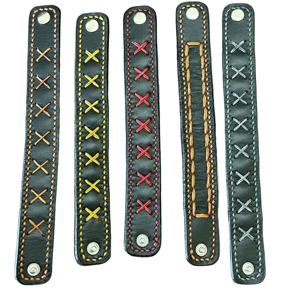 Four leather straps with different stitch patterns on a white background
