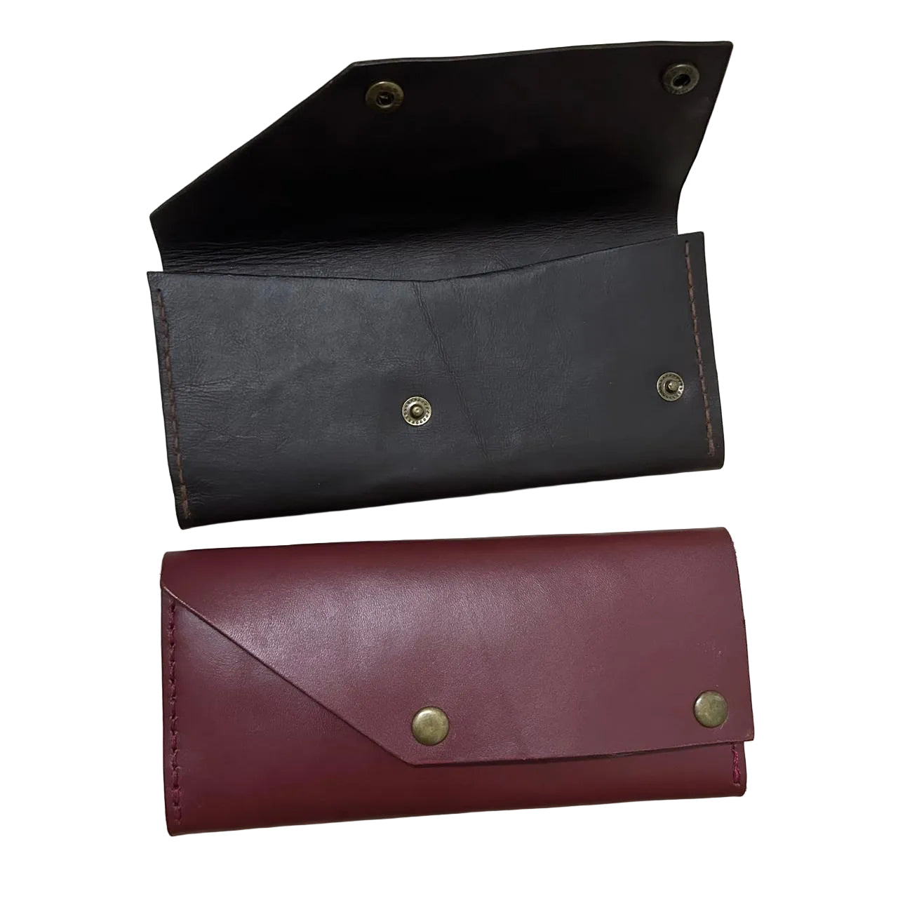 Two leather wallets, one black and one burgundy, on a light surface.